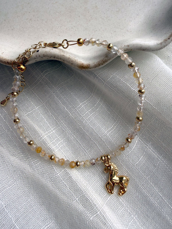 611fc05e3c4ce80992caae23_year-of-the-horse-bracelet-topaz-01_1771023001635.jpg