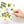 Load image into Gallery viewer, A hand with pale pink nails holds the Onderkast Studio Many Thanks Lemon Pattern Greeting Card, featuring illustrated lemons, green leaves, and white flowers. Many thanks appears in blue cursive on the front.
